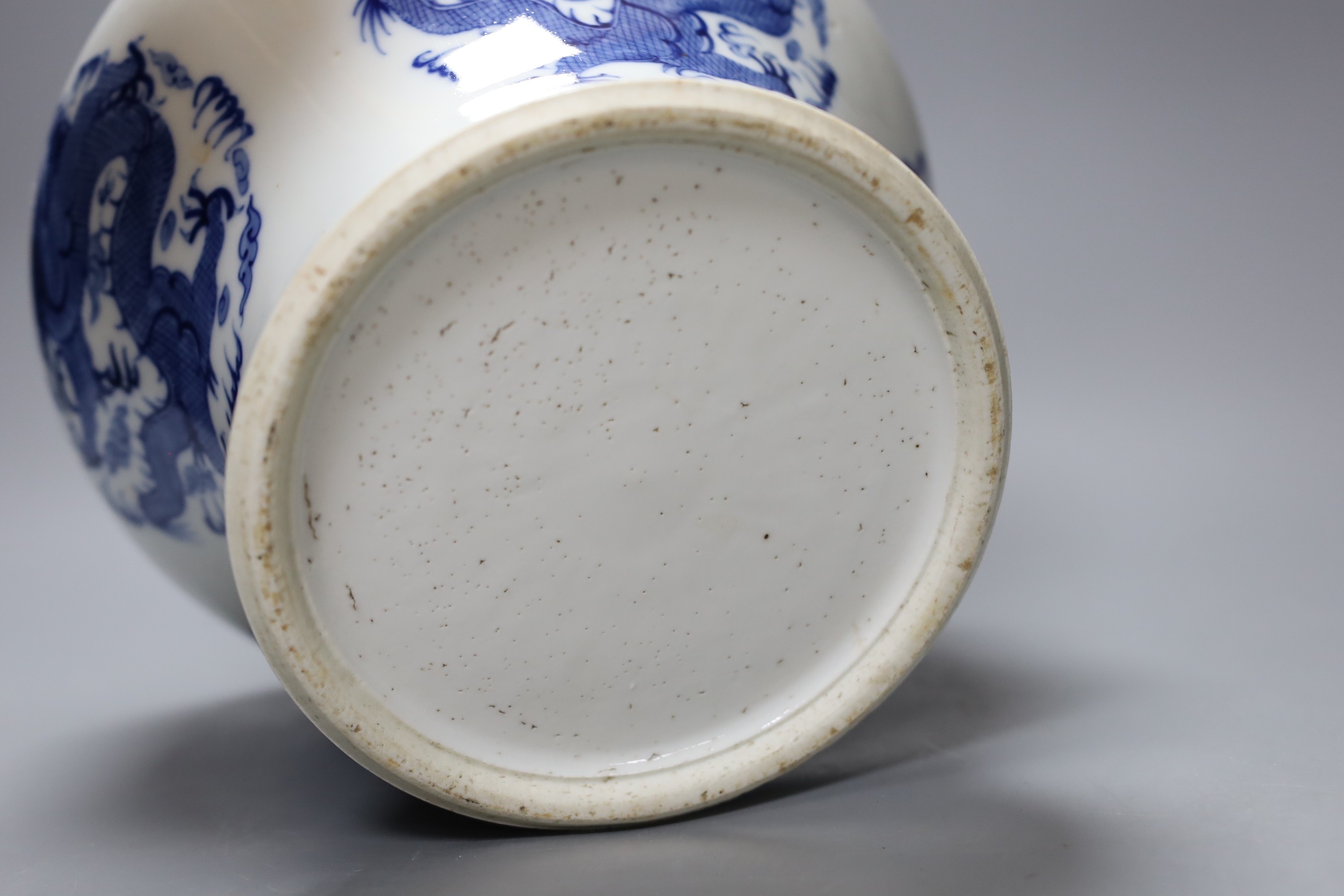 A Chinese under-glazed blue and white dragon bowl, 18cm tall